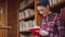 Young student girl studying in library