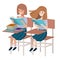 Young student girls reading in school desk
