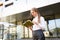 Young student looks in her diary. Stylish schoolgirl with a book in her hands is preparing for lessons