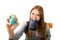 Young student tourist woman holding passport on mouth searching travel destination holding world globe