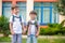 Young students, two sibling brothers, going to school.