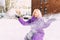 Young stylish blonde with glasses on the street in the snow.