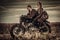 Young, stylish cafe racer couple on vintage custom motorcycles in field