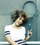 Young stylish mulatto afro-american girl playing tennis, sport healthy lifestyle people concept