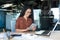 Young successful business woman working inside modern office building, Hispanic woman using tablet computer smiling and