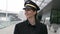 Young Successful Female Airline Captain Pilot Preparing for Flight at Airport