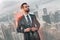 Young and successful. Handsome bearded businessman in full suit adjusting his jacket and looking away while standing