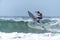 Young surfer breaking the wave, photographed in horizontal format with copy space available