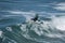 Young surfer re-enters the crest of a wave