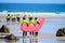 Young surfers train on Playa de Palombina Las Camaras in Celorio, Green coast of Asturias, North Spain with sandy beaches, cliffs