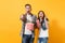 Young surprised couple woman man watching movie film on date holding bucket of popcorn plastic cup of soda or cola