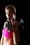 Young sweat woman woman lifting dumbbells