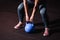 Young sweaty strong muscular fit girl hands holding heavy kettlebell on the floor concentrating and preparing for hardcore cross s