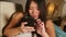 Young sweet happy and beautiful Asian Chinese woman using internet social media app on mobile phone smiling cheerful having fun at