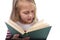 Young sweet little 6 or 7 years old with blond hair girl reading a book looking curious and fascinated