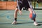 Young talent practices dribbling the basketball under his feet and improves his hand, body and foot coordination. Basketball game