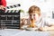 Young talented actor boy in front of the camera eating spaghetti for lunch