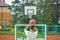 Young talented basketball player is shooting hoops on his outdoor court and training for future games and tough situations.