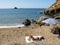 Young tanned woman in swimming suit sunbathing on a sandy beach