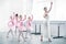 young teacher practicing ballet with adorable kids in pink