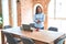 Young team leader business woman standing at the office with crossed arms, proud boss of entrepreneur