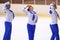 Young team from a school of skating on ice performs, disguised as sailors