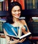 Young teen brunette muslim girl in library among books emotional close up bookwarm, lifestyle smiling people concept