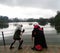 Young teen couple doing cosplay with black dress and white wigs. Anime costume.