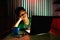 Young Teen with eyeglasses and bored in front of a laptop computer