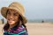 Young teen girl at beach with hat