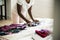 Young teen girl helping with folding the clothes