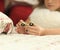 Young teen girl holding popular fidget spinner toy - closeup shot. at home on bed