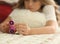 Young teen girl holding popular fidget spinner toy - closeup shot of spinner, home interior