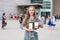 Young Teen Girl/Middle School student standing in front of school with awards and diploma after Grade 8/Middle school graduation c