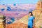 Young teen girl standing at the Grand Canyon