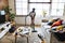 Young teen girl vacuuming up the house