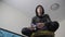 Young teen and joystick man hooded sweater absorbed In online video game. boy teenager in the hood playing video games