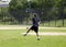 Young teen practices batting at baseball field Bronx NY