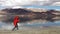 Young teen stone skipping on Tso Moriri lake with the mountain background, Ladakh,India