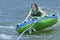 Young Teen Tubing Behind a Boat