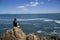 Young teenage boy fishing by the sea