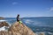 Young teenage boy fishing by the sea