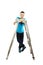 Young teenage boy leaning on a stepladder