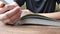 Young teenage boy read comic book at library.