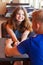 Young teenage couple sitting in cafe