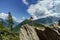 Young teenage girl posing on big stone in Alps