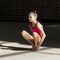 A young teenage girl prepares for performance, warming up and performs gymnastic elements at the competitions.