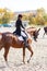 Young teenage girl riding horse. Equestrian sport