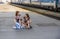 Young teenage girls wait for the train