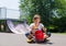 Young teenage roller skater with her helmet